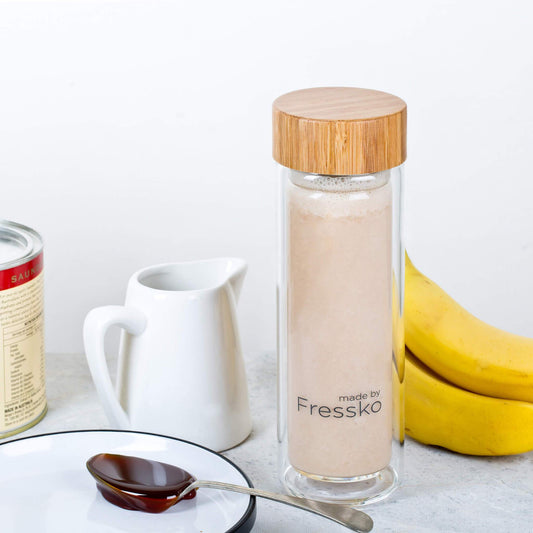 Banana malt smoothie in a glass fressko flask